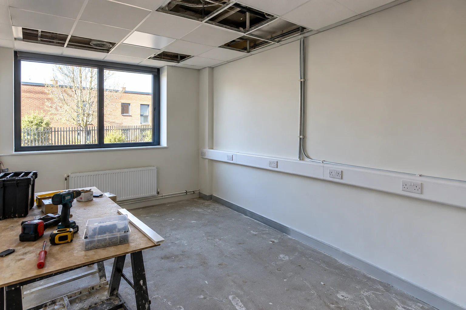 Empty commercial premises during an electrical fit-out with enclosed socket trunking