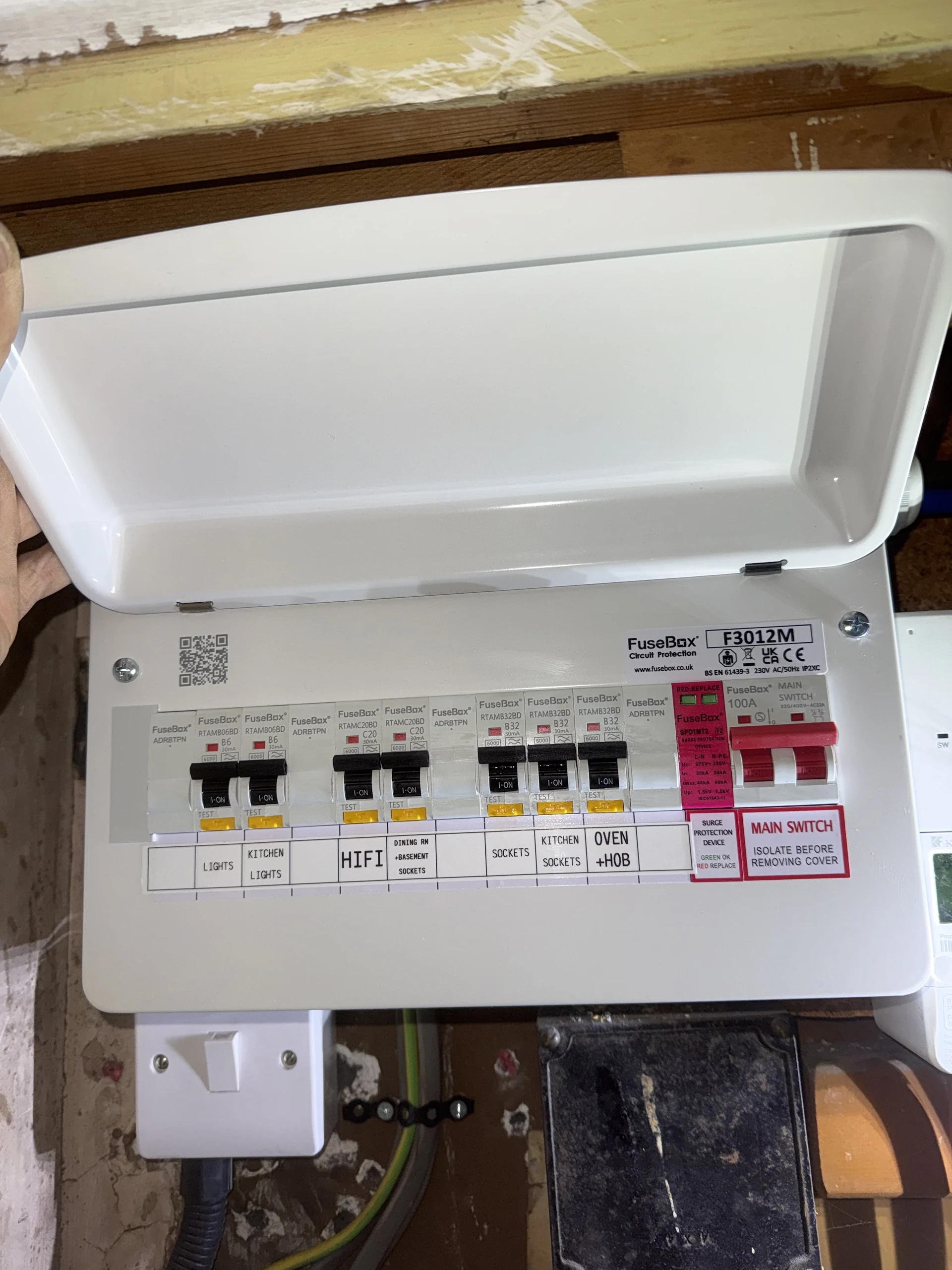 Enclosed consumer unit with labelled circuits and protective devices