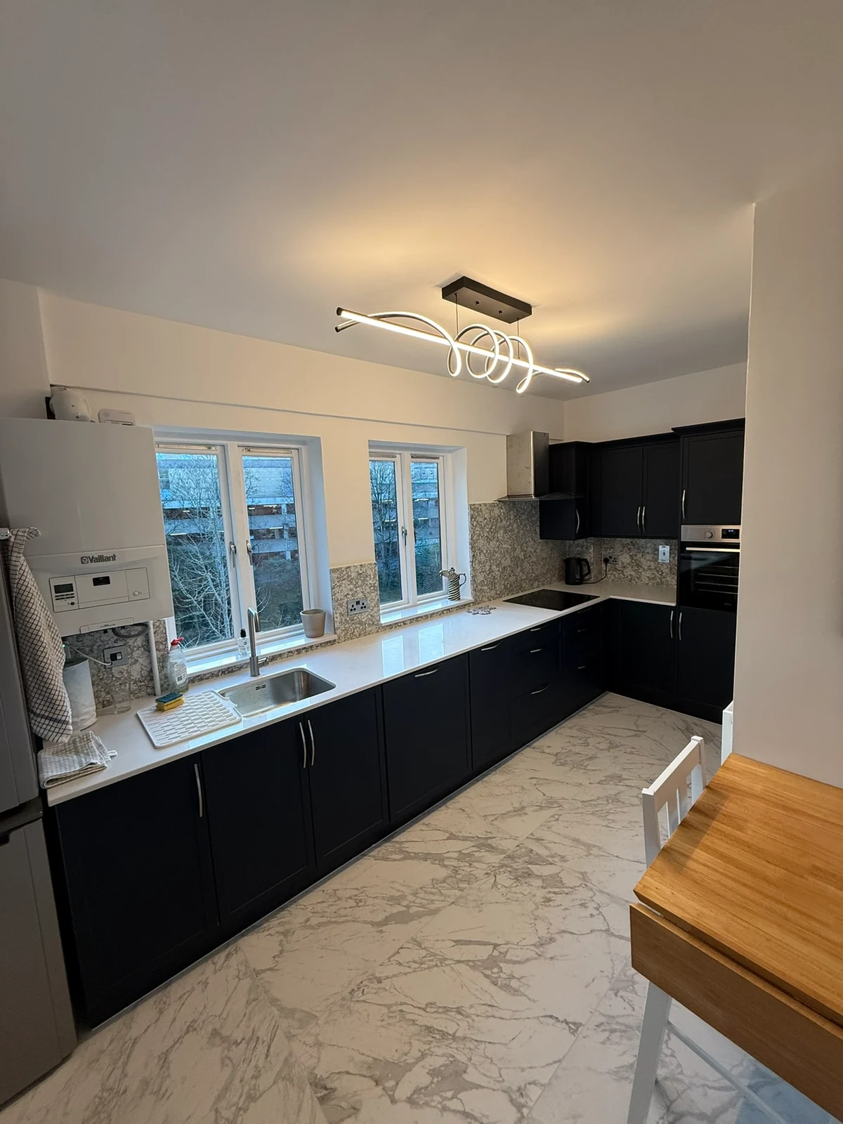 Feature pendant and task lighting in a fitted kitchen