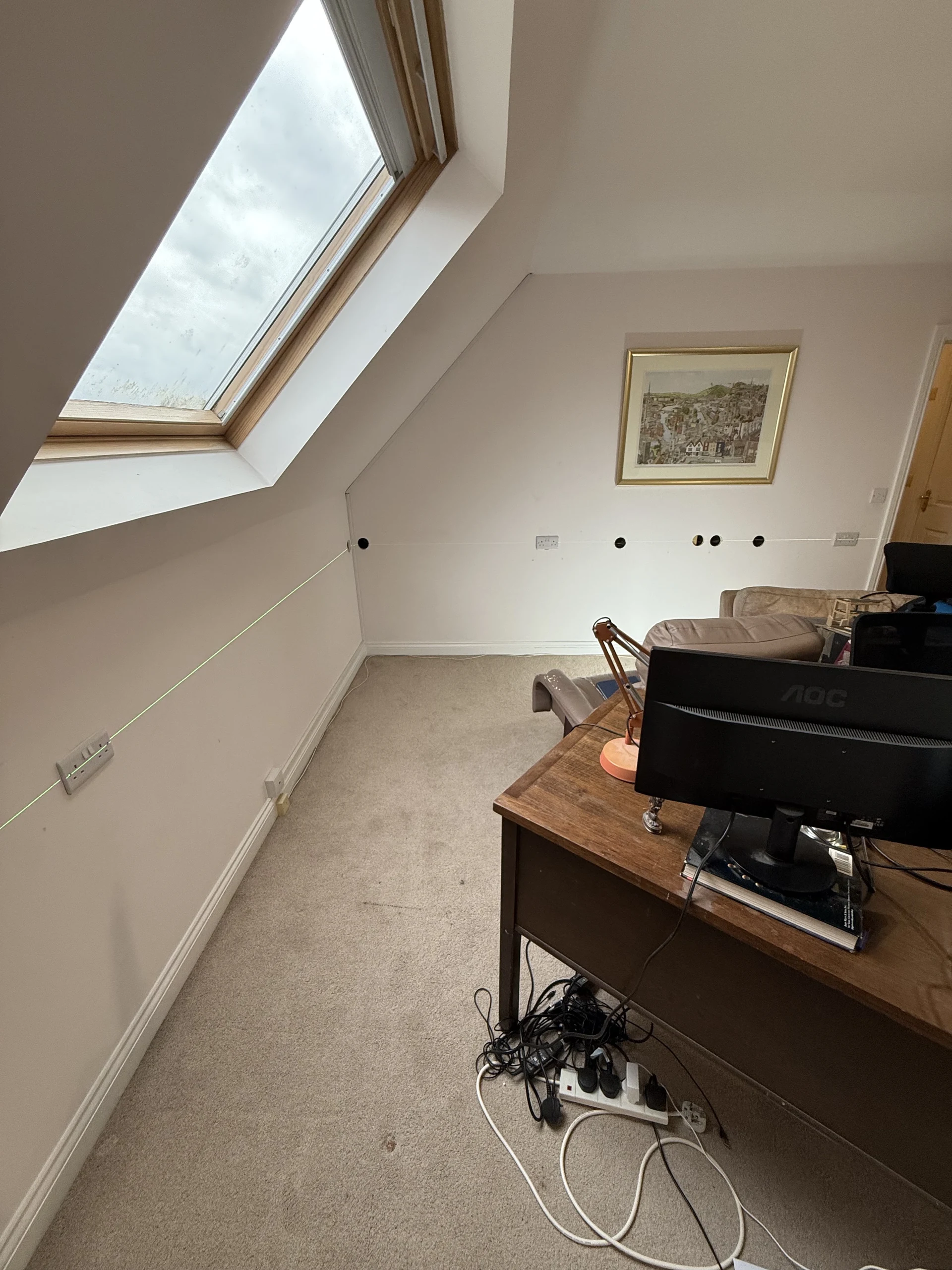 Power points and a desk in a loft room