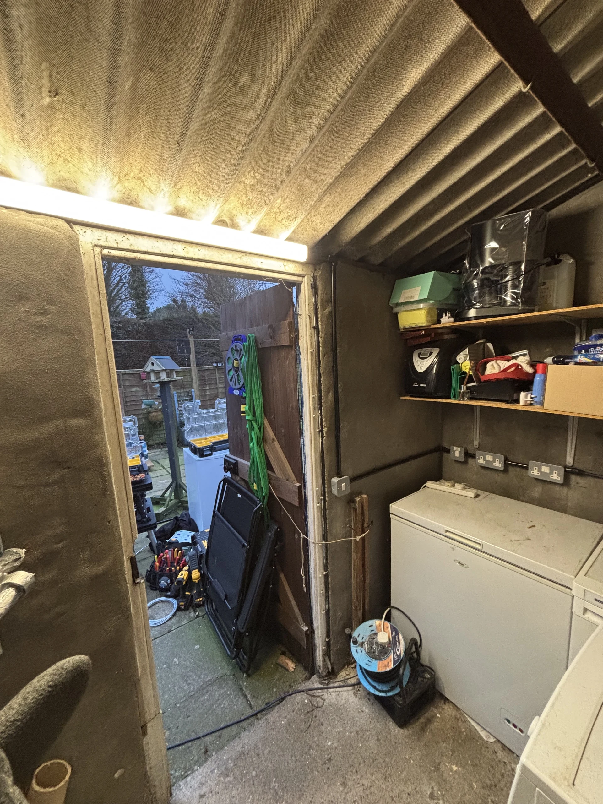 Batten lighting and surface electrical fittings in an outbuilding